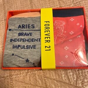 New F21 zodiac socks in box. They’re ‘Aries’ New ARIES Zodiac 2pk